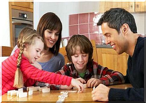 family playing dominoes