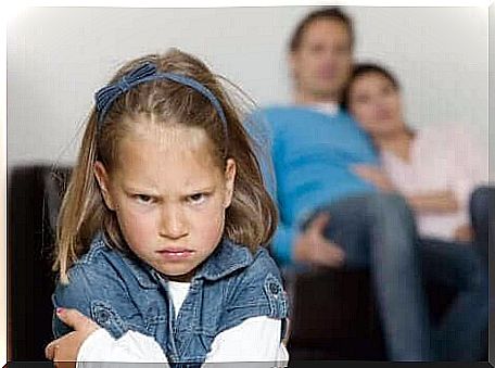 A little girl making a face.