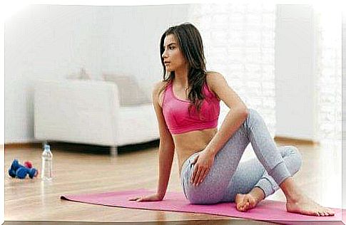 A woman doing lumbar strengthening exercises