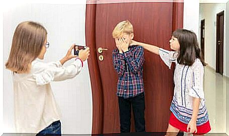 A young boy bullied by two girls. 