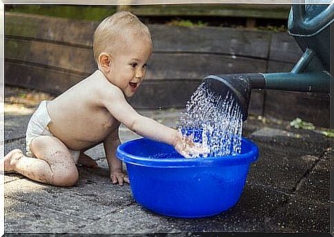 A child plays with water