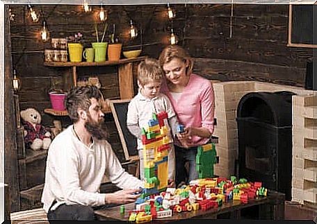 A family playing a building game.