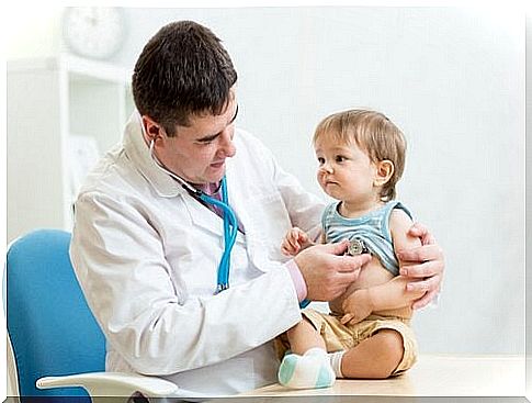 examining the baby to check for whooping cough