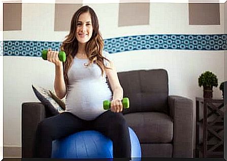 A pregnant woman doing exercises. 