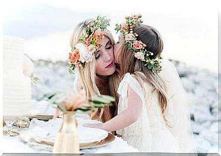 A mother and her daughter wearing a wreath of flowers