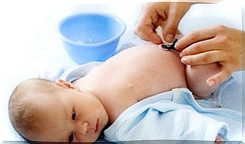 A baby getting cord treatment