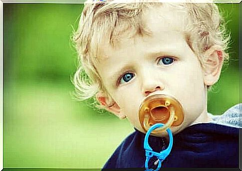 blond baby with pacifier