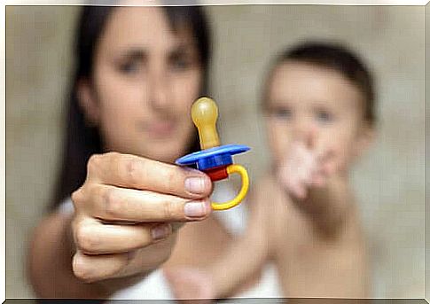 woman holding pacifier