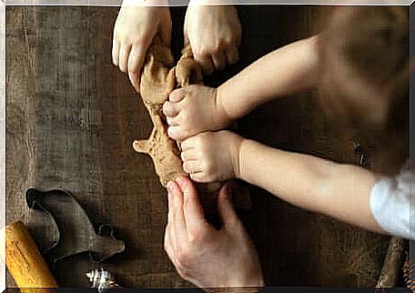 Children's hands handling soil. 