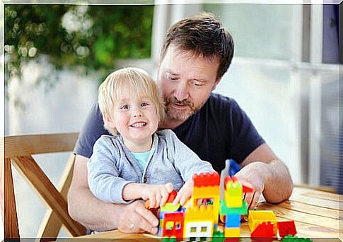 Father and son enjoying the psychological benefits of LEGOs.