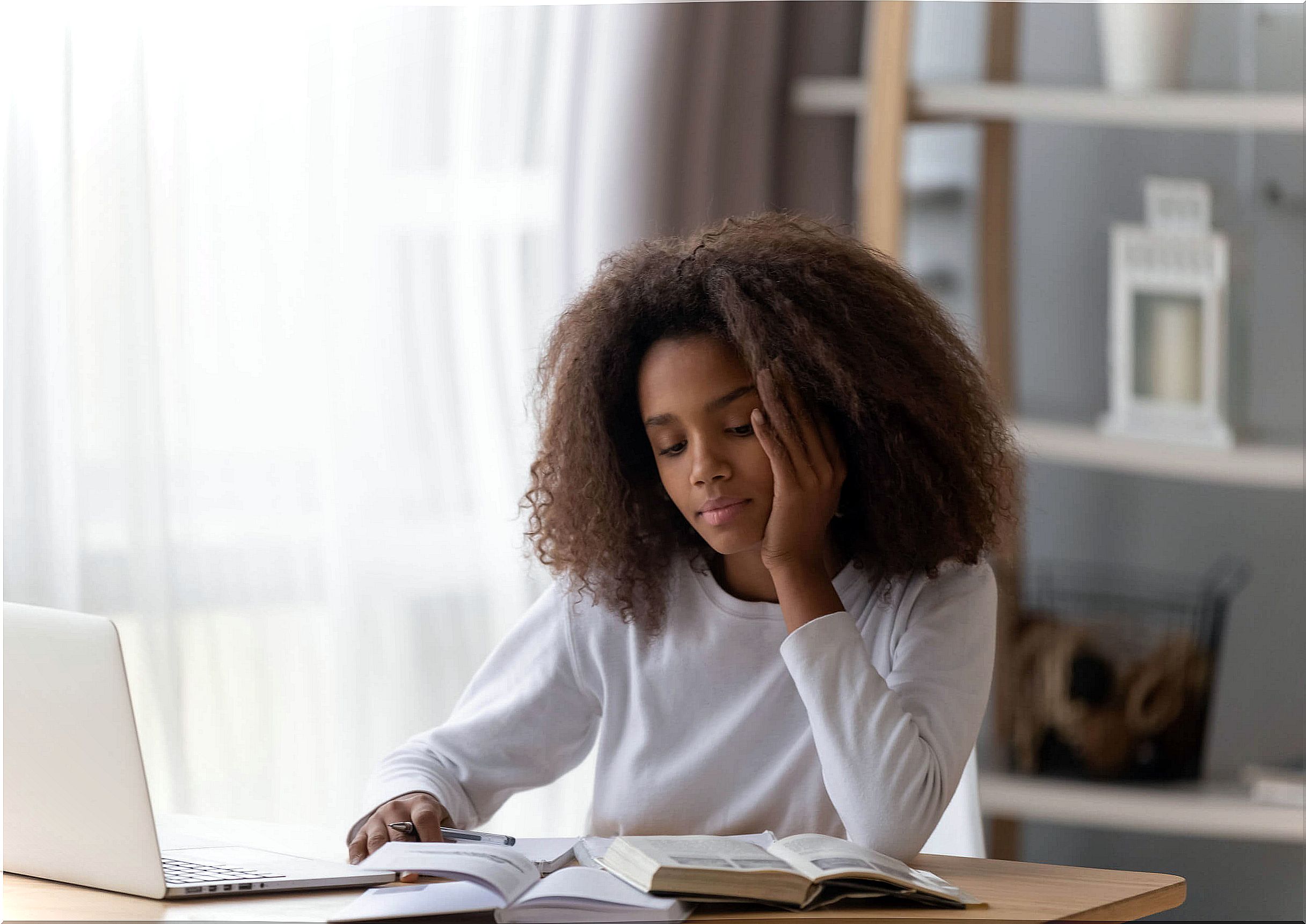 A teenage girl studying. 