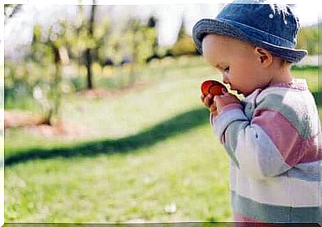 A young child playing outdoors. 