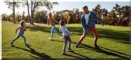 A family that plays together outdoors. 