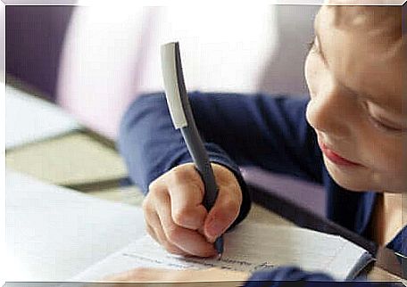 A child who is learning to write.